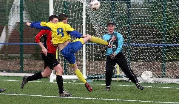 UCC keeper James Purcell watches as the Hall's Gavin Draper tries a volley that didn't quite come off. urphy's Stout AUL 1, Moneygourney, Douglas Hall 1 UCC 0, 21.02.09, Billy Lyons 087 7937789