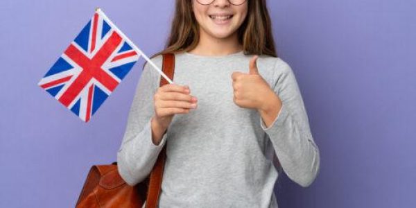 Child,Holding,An,United,Kingdom,Flag,Over,Isolated,Background,Giving